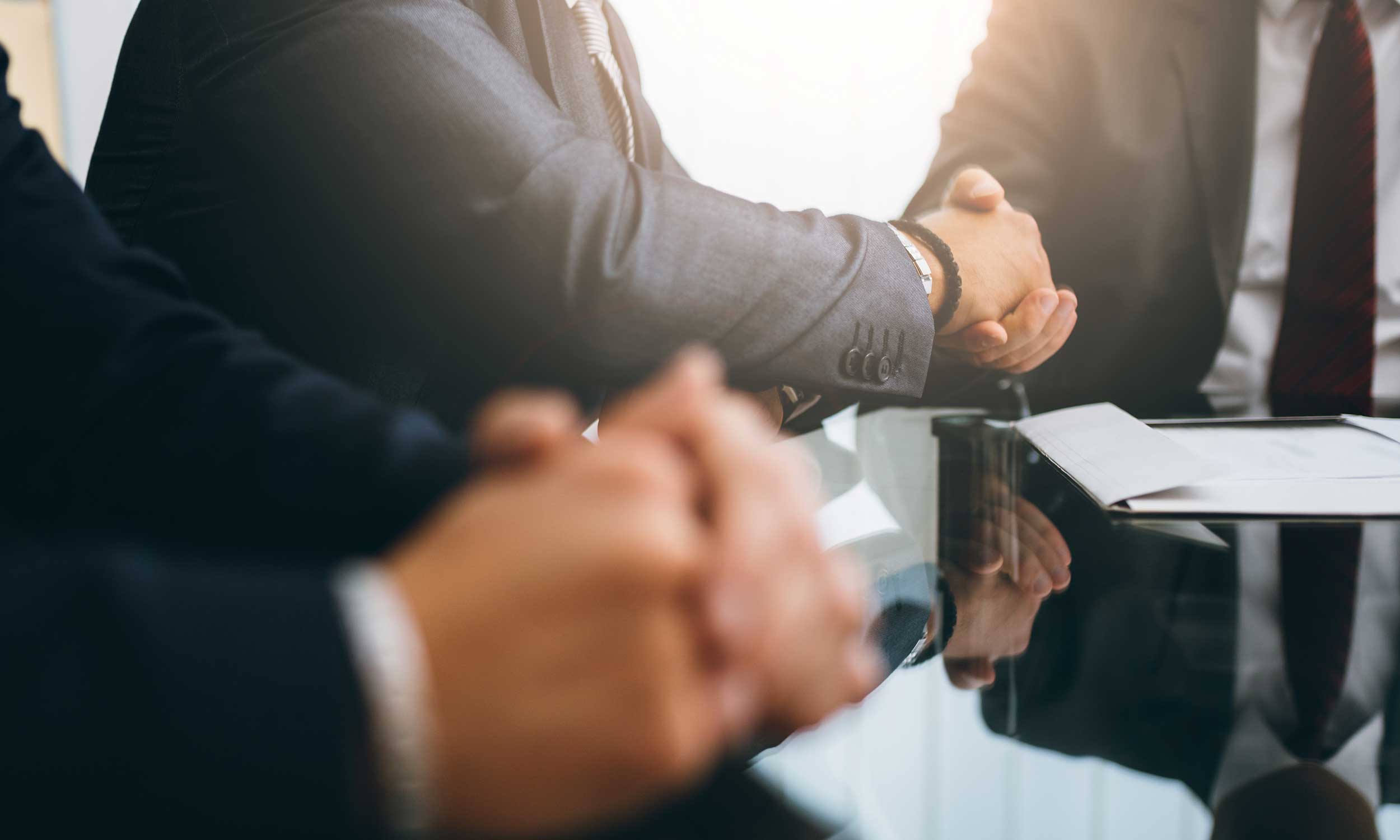 tobacco lawsuit lawyers shaking hands